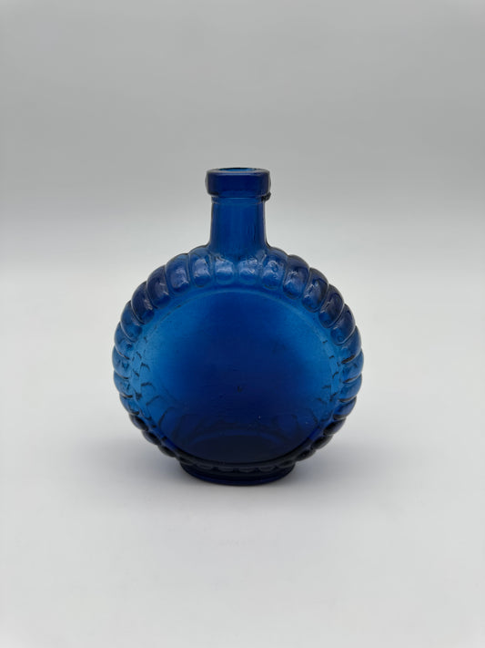 Vintage blauwe parfum fles